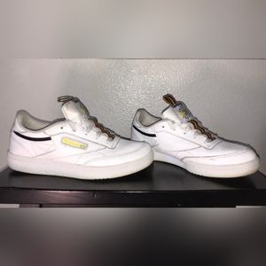 White with red black and yellow lining, size 3, Reebok tennis shoes